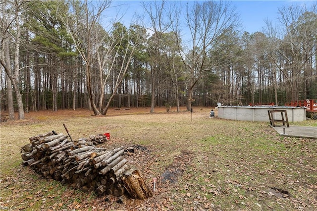 view of yard featuring an outdoor pool