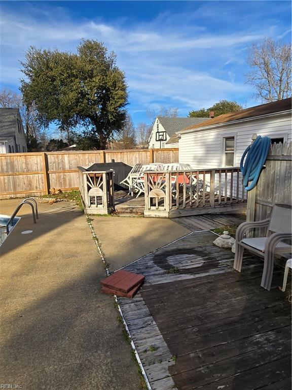 view of patio / terrace featuring a deck and fence