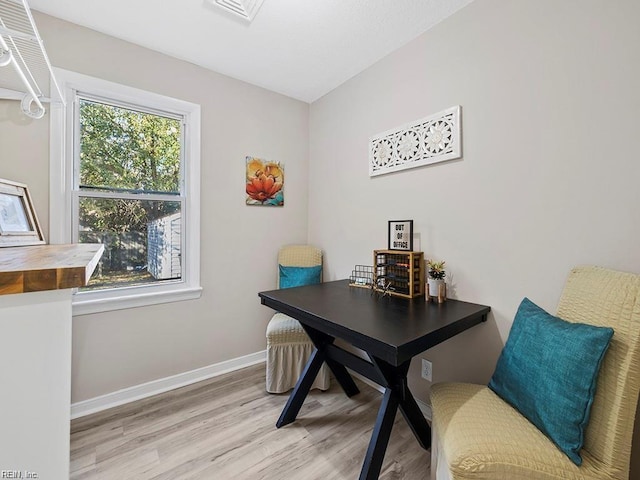 office with visible vents, light wood-style flooring, and baseboards