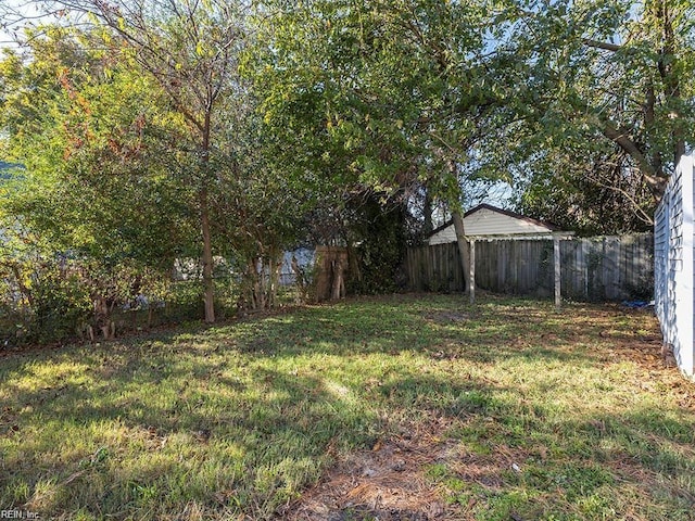 view of yard with a fenced backyard