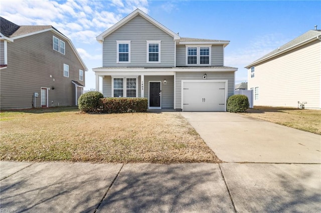 traditional-style house with an attached garage, a front lawn, and concrete driveway