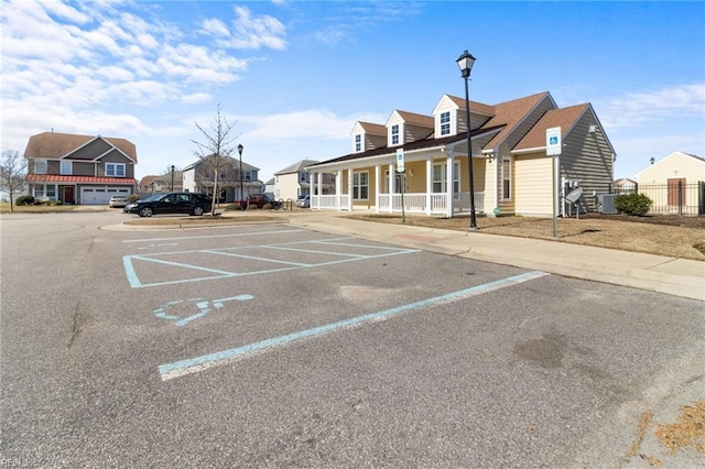 uncovered parking lot with a residential view