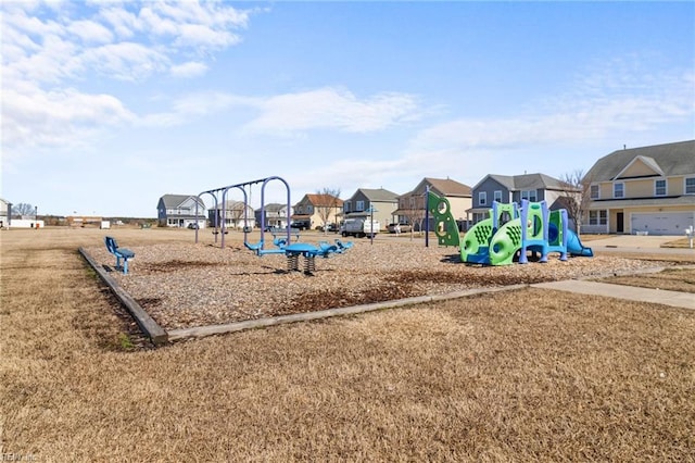 community jungle gym featuring a residential view and a yard