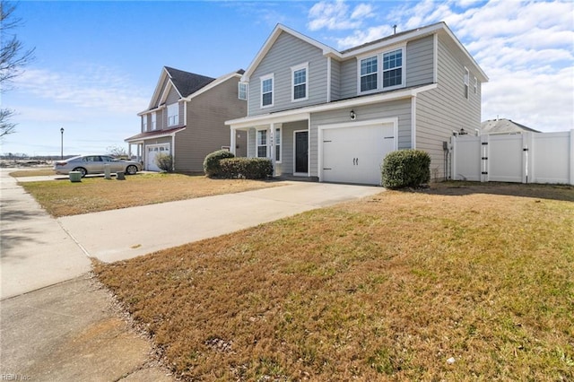 traditional-style home with a garage, fence, driveway, a gate, and a front yard