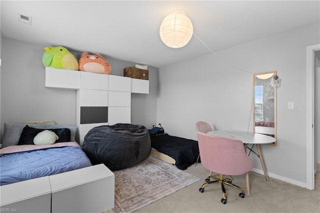 bedroom featuring baseboards, visible vents, and light colored carpet