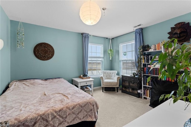 carpeted bedroom with visible vents