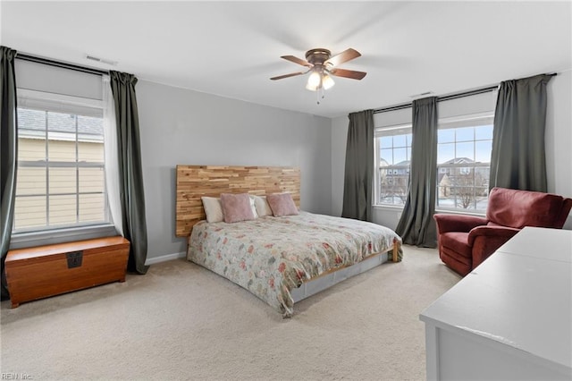 bedroom featuring carpet, visible vents, and ceiling fan