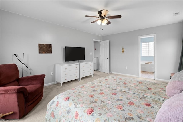 bedroom featuring connected bathroom, light carpet, a ceiling fan, visible vents, and baseboards