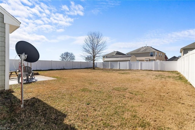 view of yard featuring a patio and a fenced backyard