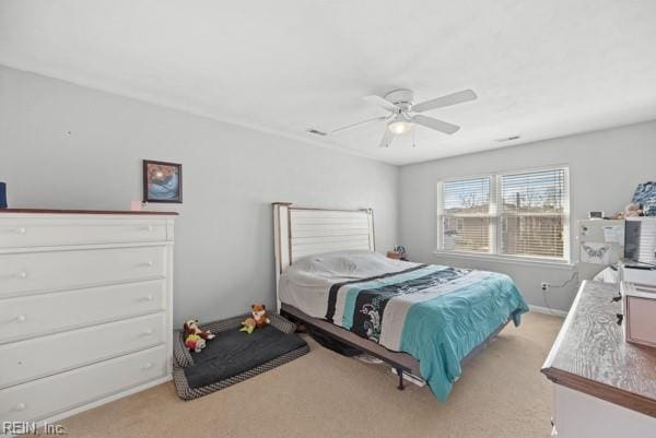 bedroom featuring a ceiling fan and light colored carpet