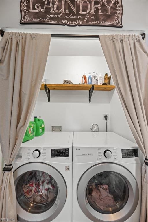 laundry room featuring laundry area and washer and clothes dryer