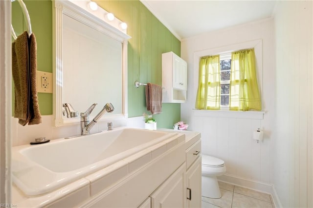 bathroom with toilet, tile patterned floors, and vanity