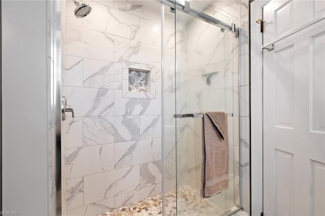 bathroom featuring a shower stall