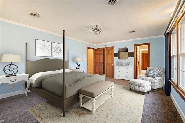 bedroom featuring ornamental molding, carpet flooring, visible vents, and baseboards