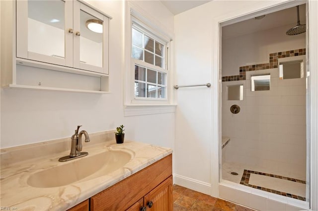 bathroom featuring a stall shower and vanity