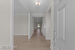 corridor with wood finished floors