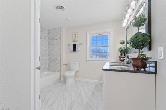 bathroom featuring marble finish floor, bathing tub / shower combination, visible vents, vanity, and baseboards