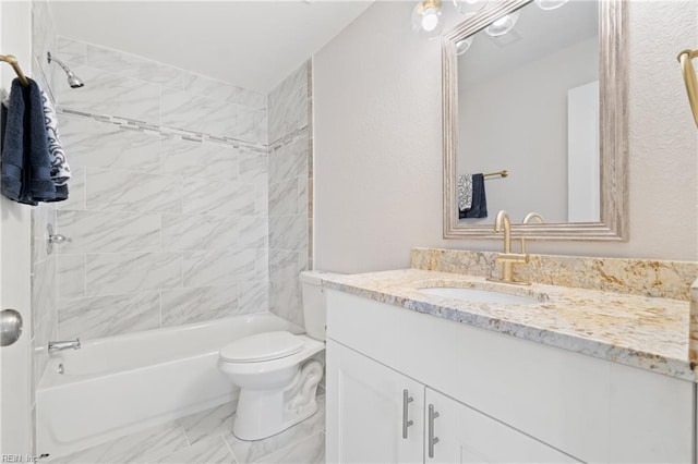 bathroom with marble finish floor, shower / bathing tub combination, vanity, and toilet