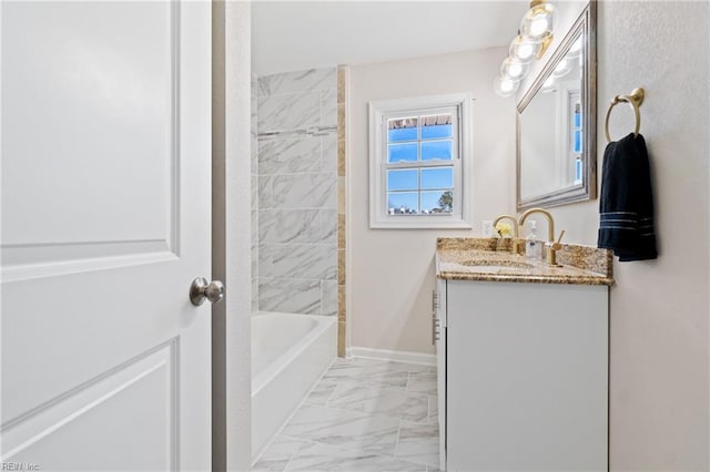 bathroom with marble finish floor, shower / tub combination, baseboards, and vanity