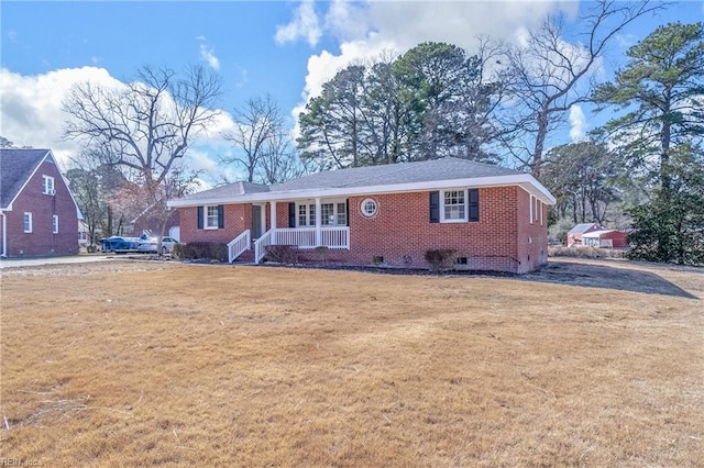 ranch-style home with brick siding, crawl space, and a front lawn