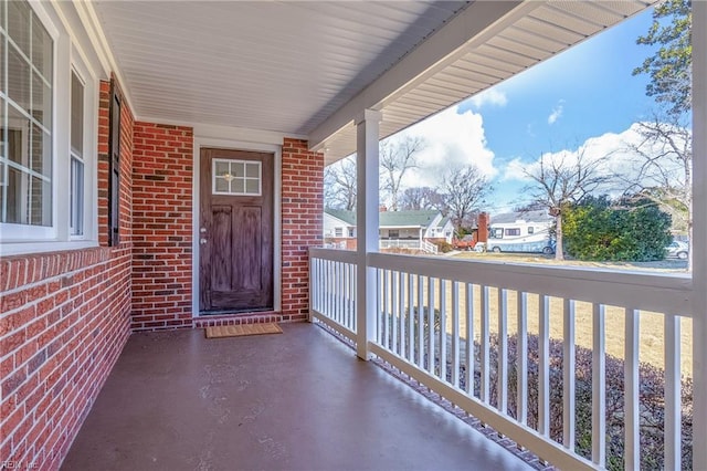 property entrance featuring brick siding and a residential view