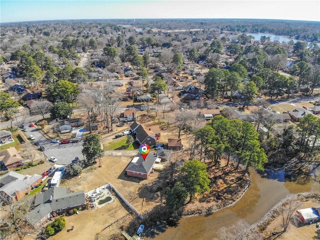 drone / aerial view with a water view and a residential view