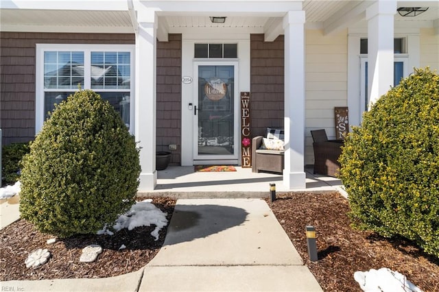 doorway to property featuring a porch