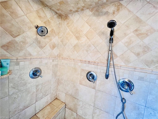 interior details featuring tiled shower