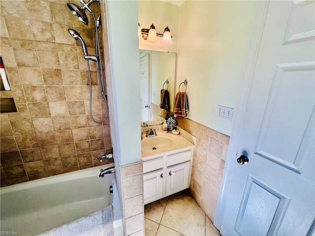 full bathroom with tile walls, shower / bathing tub combination, wainscoting, vanity, and tile patterned flooring