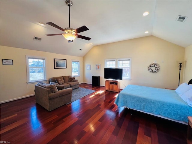 bedroom featuring visible vents, vaulted ceiling, and multiple windows