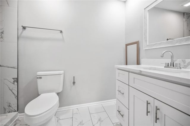 bathroom with toilet, marble finish floor, baseboards, and vanity