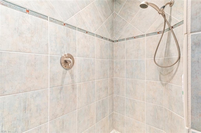 full bathroom with a tile shower