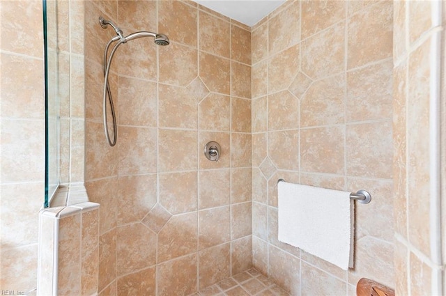 full bathroom with a tile shower