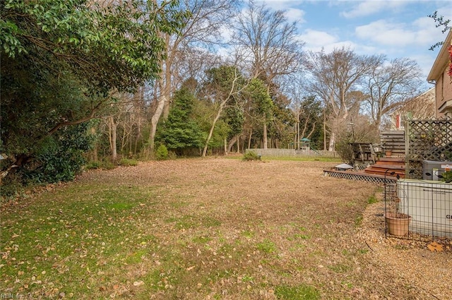 view of yard featuring a wooden deck