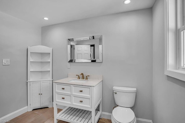 bathroom featuring recessed lighting, baseboards, vanity, and toilet