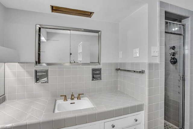 full bath featuring a shower stall and vanity