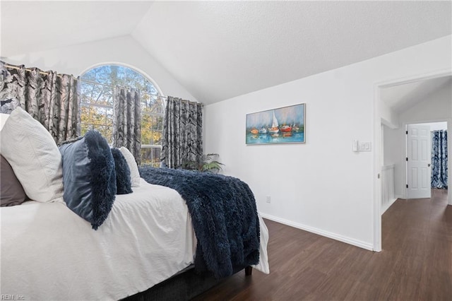 bedroom featuring lofted ceiling, dark wood-style flooring, and baseboards