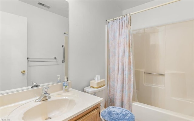 bathroom featuring toilet, shower / tub combo, vanity, and visible vents