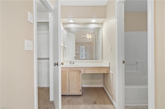 full bathroom featuring a ceiling fan, vanity, and baseboards