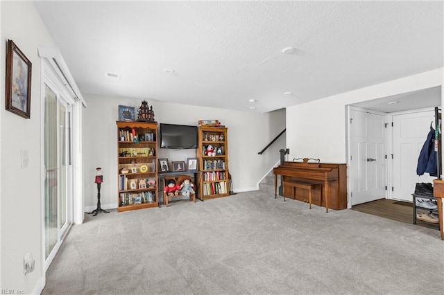 interior space featuring carpet, stairs, and baseboards