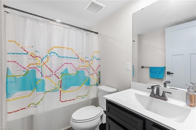 bathroom featuring toilet, visible vents, and vanity