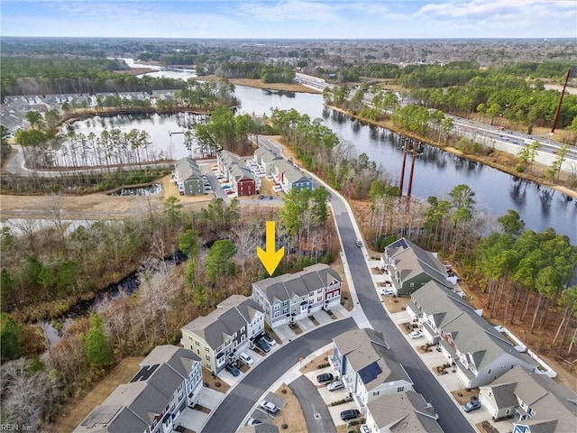 aerial view with a residential view and a water view