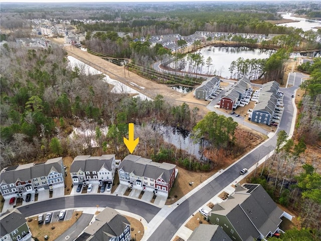 birds eye view of property featuring a water view and a residential view