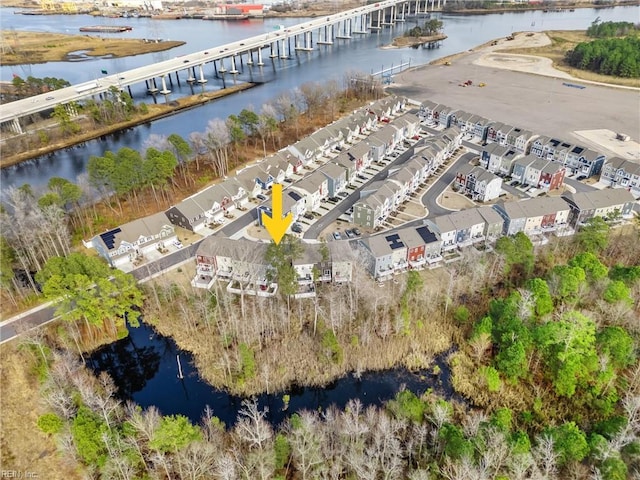 birds eye view of property featuring a residential view and a water view