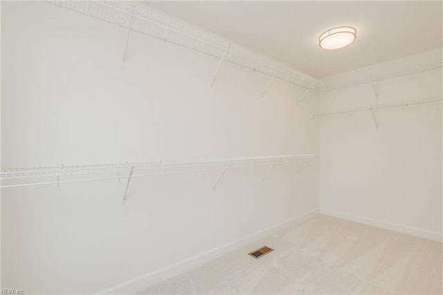 spacious closet with carpet and visible vents