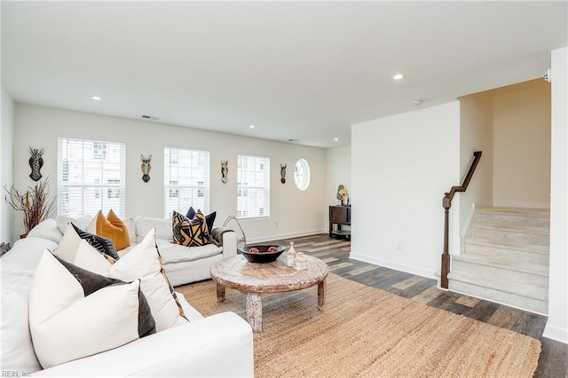 living area featuring stairs, baseboards, wood finished floors, and recessed lighting