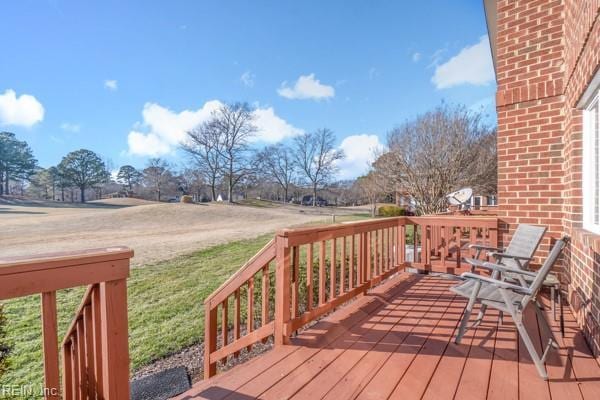 wooden deck with a yard