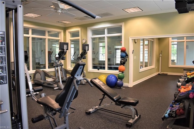 gym featuring crown molding, visible vents, ceiling fan, and baseboards