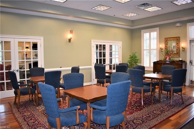 dining area with french doors and wood finished floors