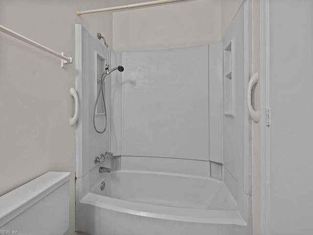 bathroom featuring bathing tub / shower combination and toilet